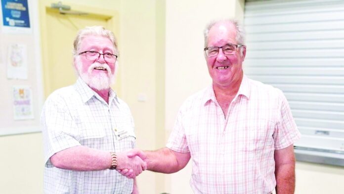 Probus President Wes Dean inducting new member Peter McDonald
