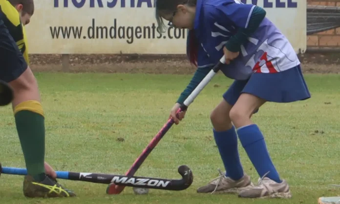 Kaniva Raiders’ Agnes fights for the ball in attack against Dimboola Kangaroos.
