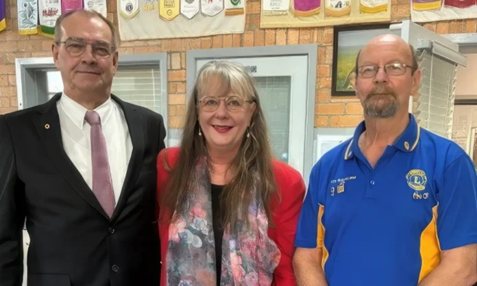 President Tony Lord with partner Leanne Watson and outgoing President Ian Meek.