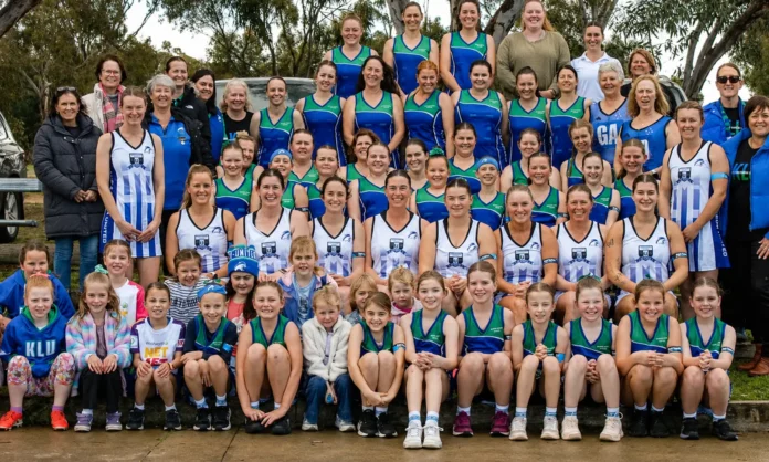 A Grade netball players with specially designed 30-year anniversary dresses and other Kaniva Leeor United grade netballers and officials.