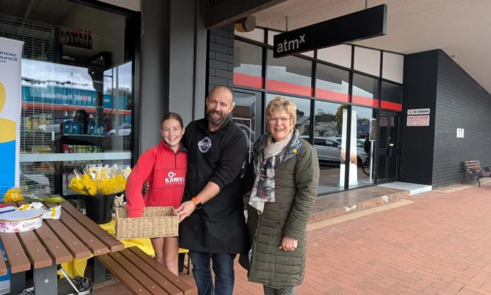 Drawing the raffle - Lola and Lachie Doyle with Heather Wallis, leader of Kaniva Cancer Council Group.