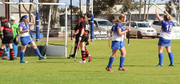 Nyree Hutchins, Delt a, and Lisa Stimson celebrate a Kaniva W omen goal in their w in over Horsham Jets.