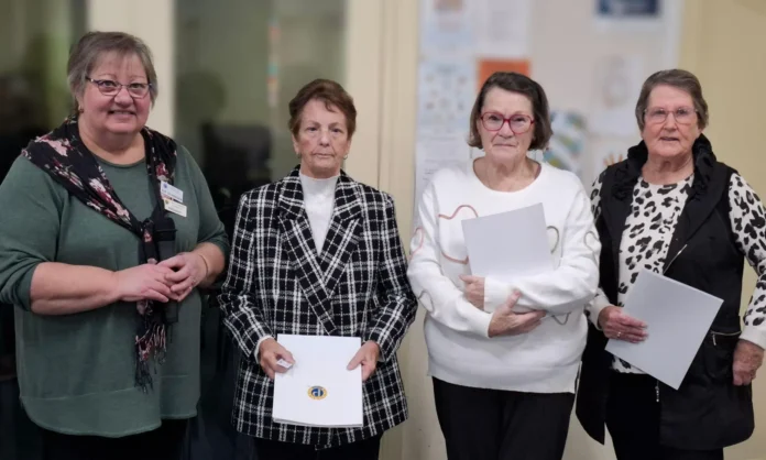 President Sue Schneider inducting new members Cheryl Lowe, Jan French and Kay Fritsch.