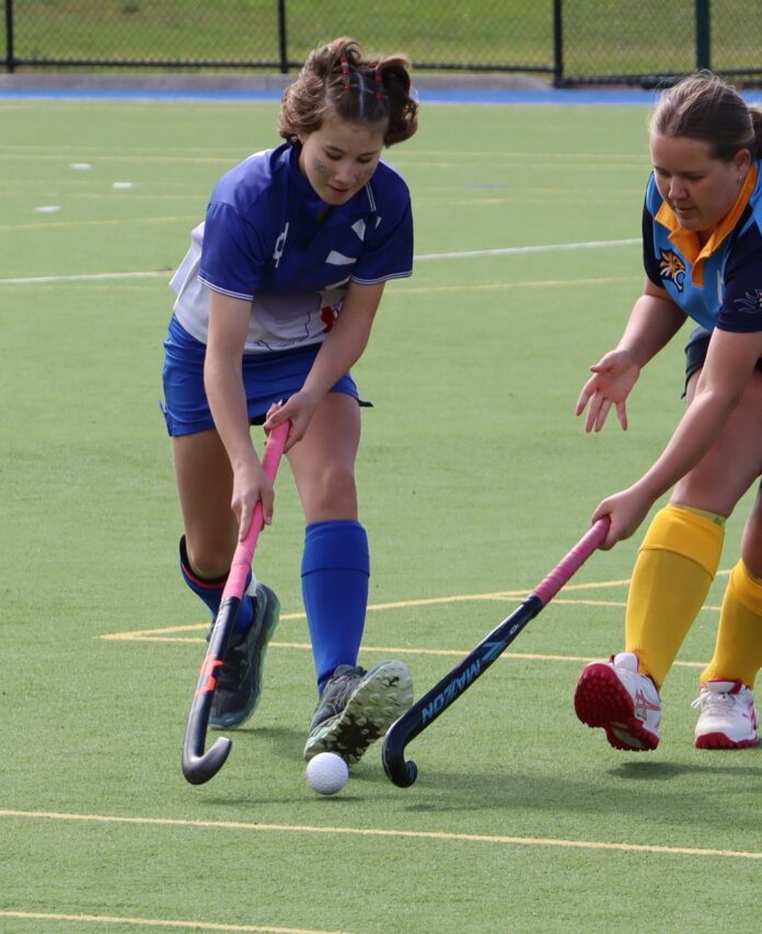Kaniva Raiders’ defender Olive in contest for the ball with Nhill Leopards’ Chelsea.